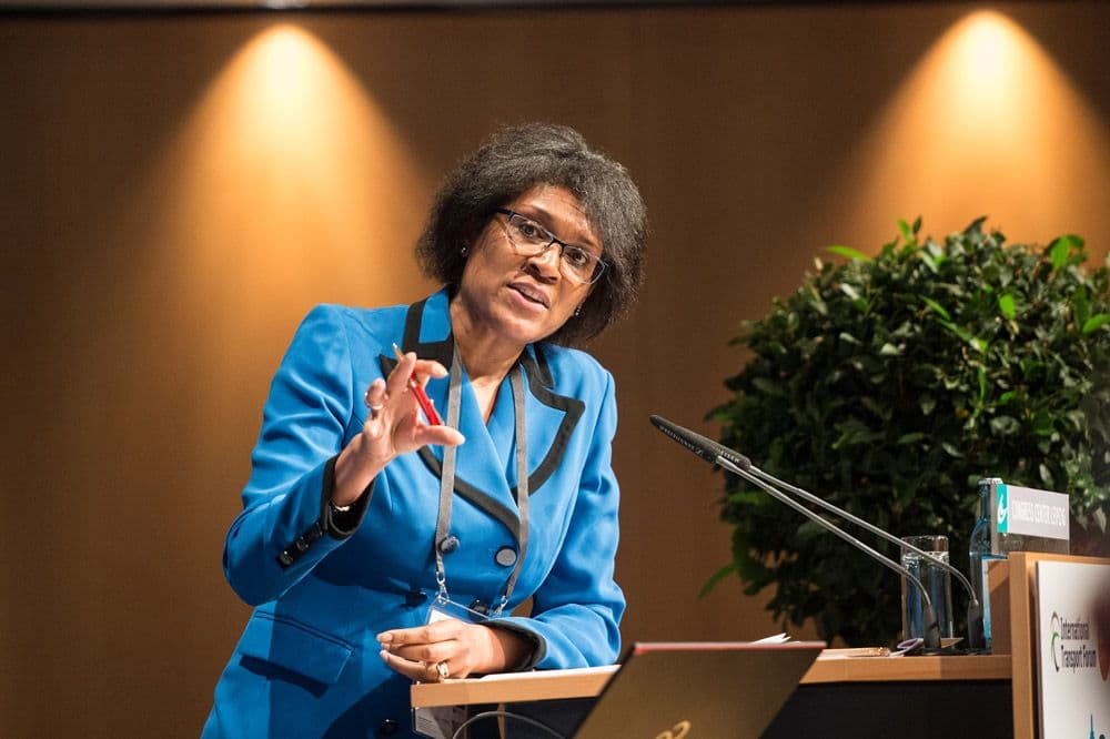 Juliette Foster moderating a conference discussion
