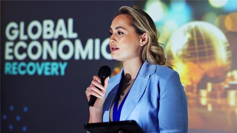 Female event host speaking at a corporate event